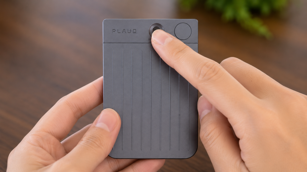 Close-up of a hand sliding the front recording mode switch downward on a PLAUD Note to activate normal face-to-face recording mode.